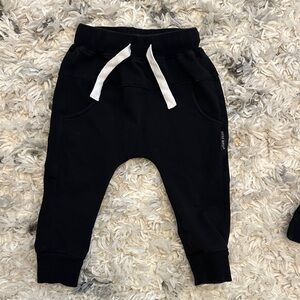 Little Bipsy Black Kids Joggers with White Drawstrings and black pullover shirt.